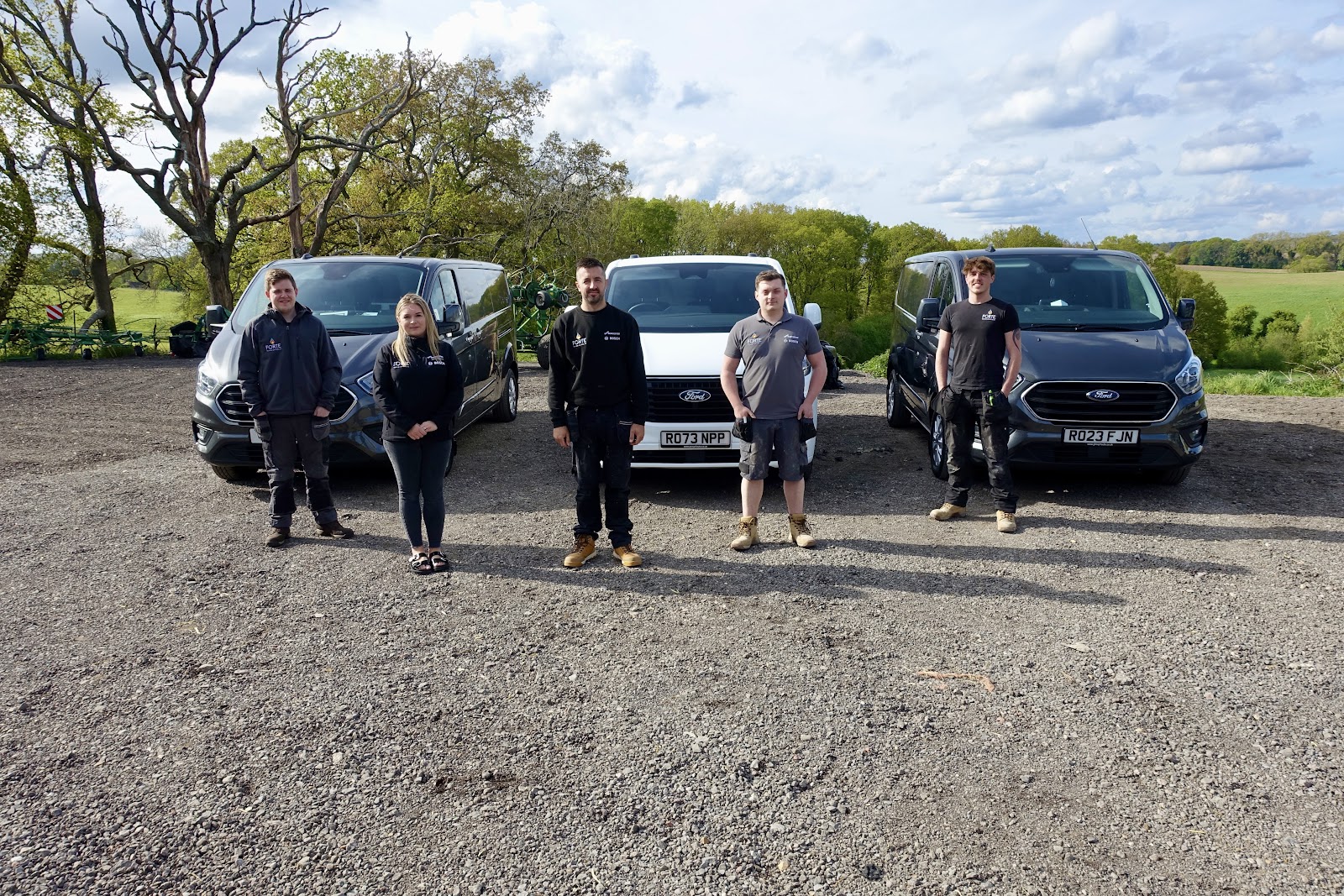 The Forte Heating Services team in front of their vans